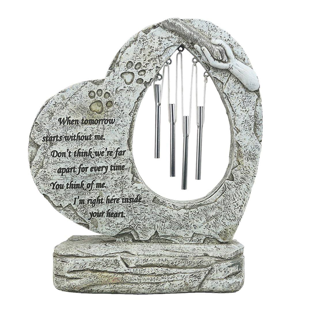 Carchistan dog memorial stone with wind chimes for outdoor remembrance.