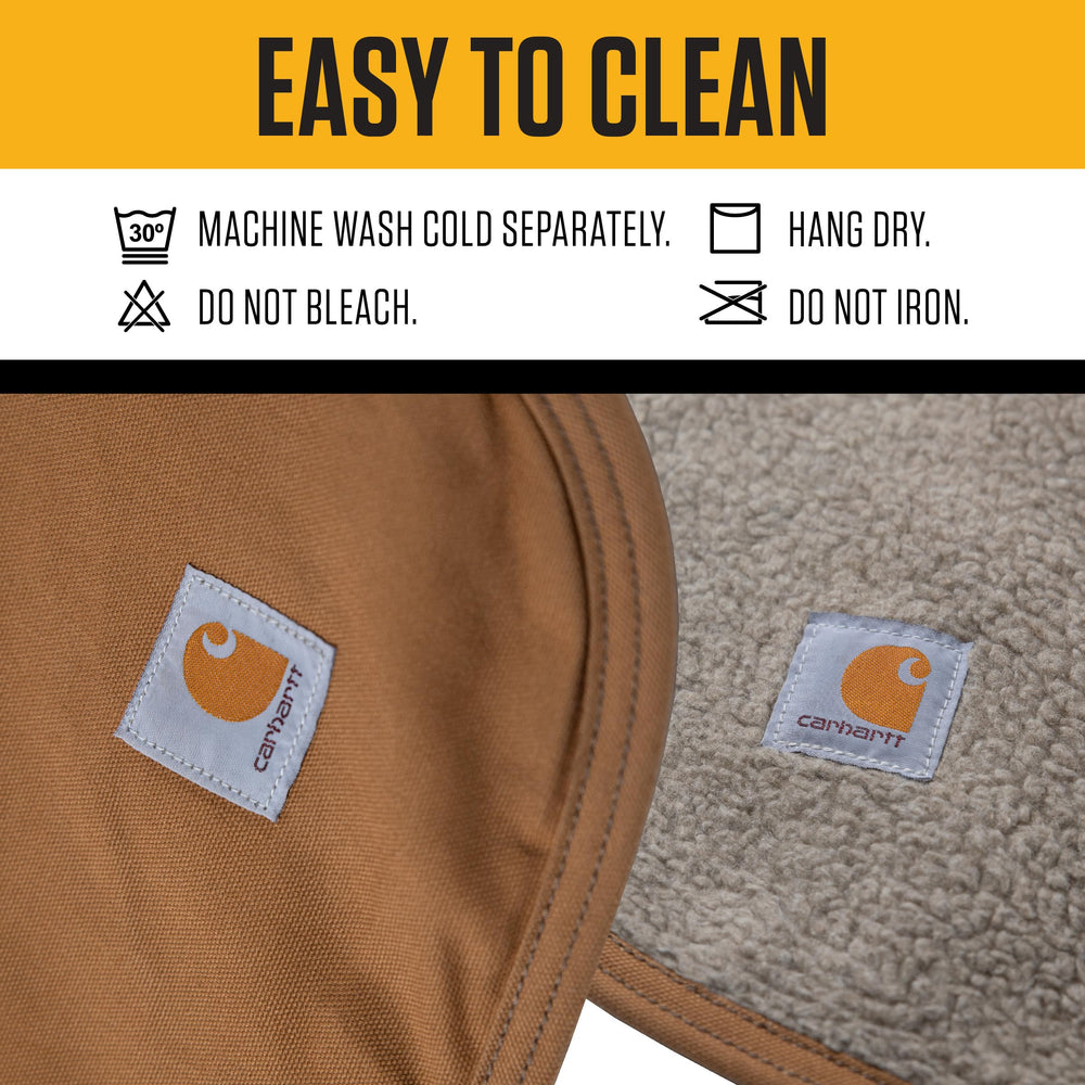 Carhartt Firm Duck Sherpa-Lined Blanket shows water-repellent canvas side protecting furniture.
