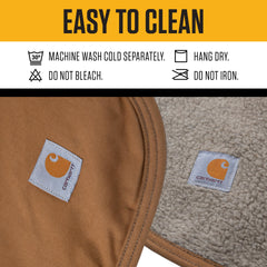 Carhartt Firm Duck Sherpa-Lined Blanket shows water-repellent canvas side protecting furniture.