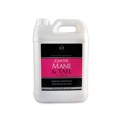 Applying Canter Mane & Tail spray to a mane during grooming.