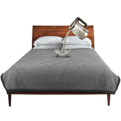 Catalonia waterproof blanket on a bed protecting against spills and stains