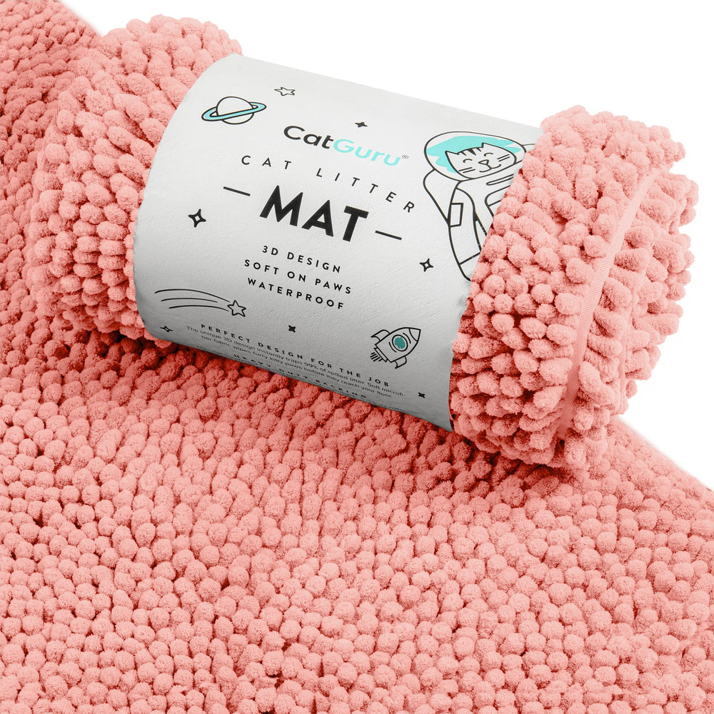 CatGuru Litter Mat XL coral with 3D design traps litter and protects floors.