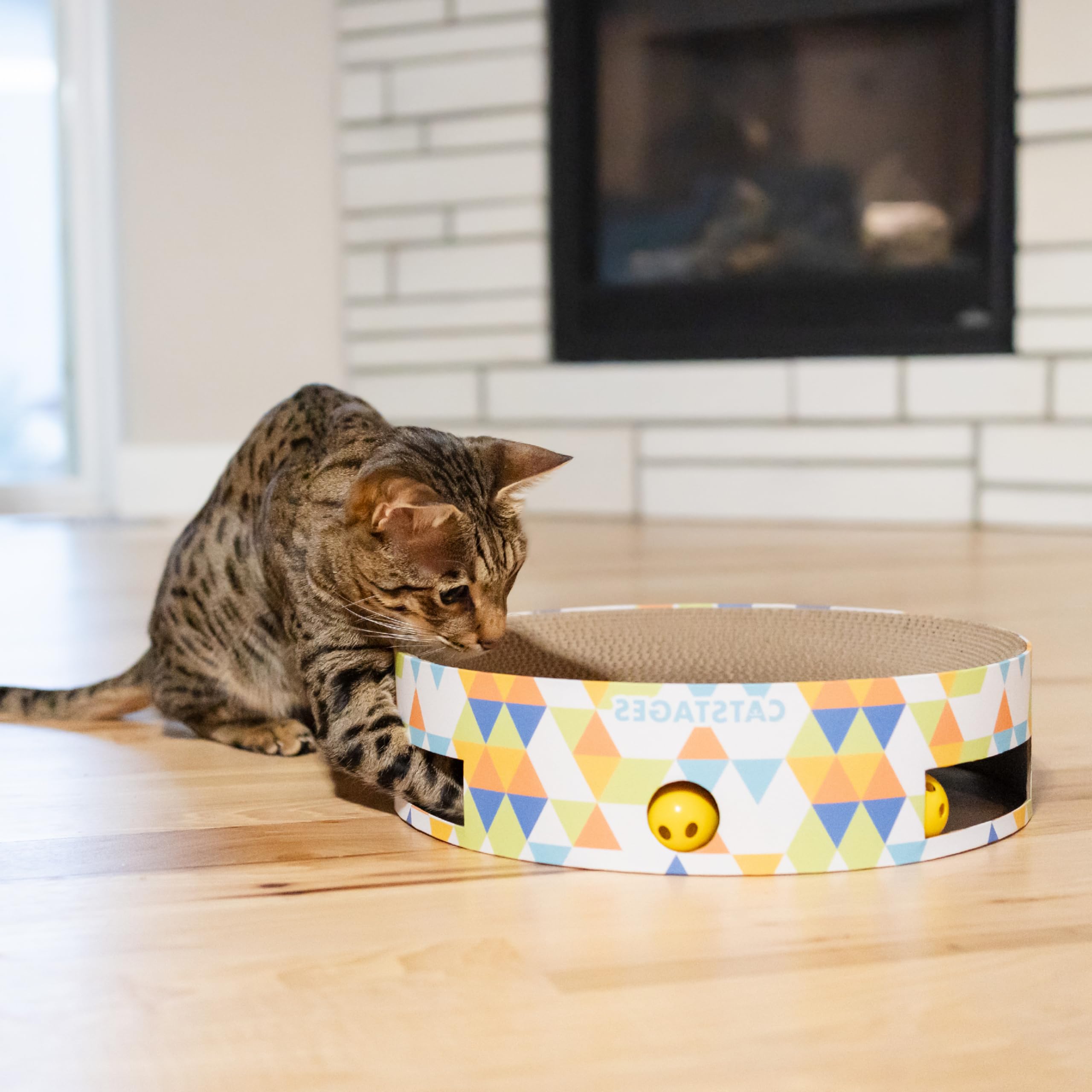 Catstages cat playing with balls demonstrates dynamic, engaging exercise opportunities.