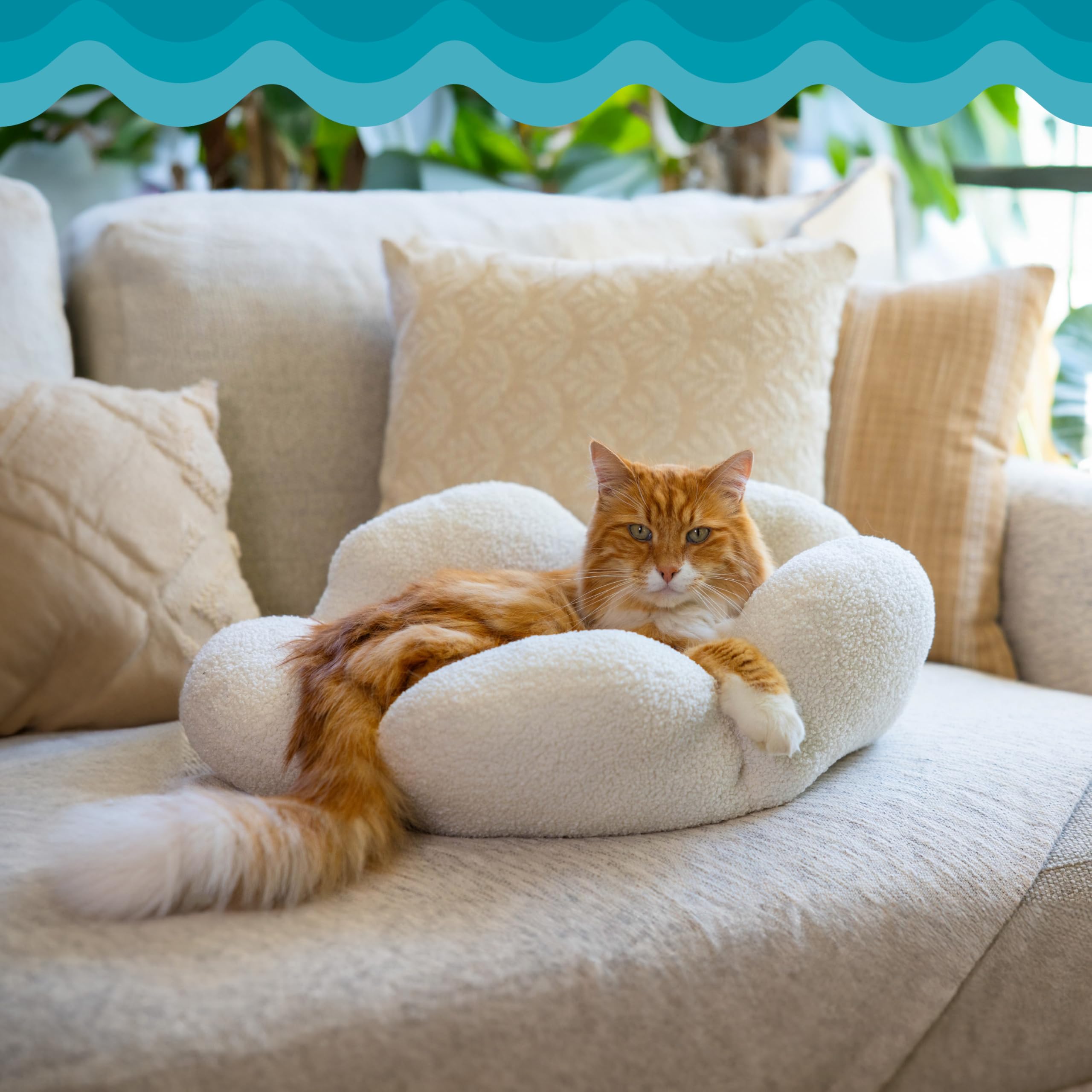 Catstages Purrfect Petals accommodates cats up to 20 lbs for lounging.