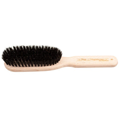 Chris Christensen brush with 8-row boar bristles for even oil distribution