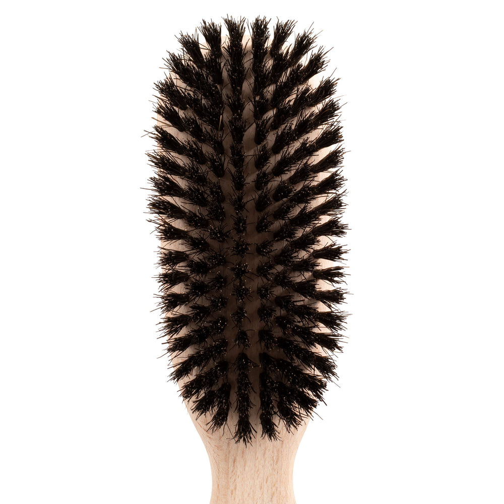 Chris Christensen brush in use during a dog grooming session