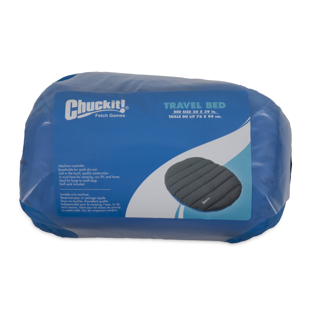Blue-gray Chuckit! travel bed placed in a car for travel comfort.