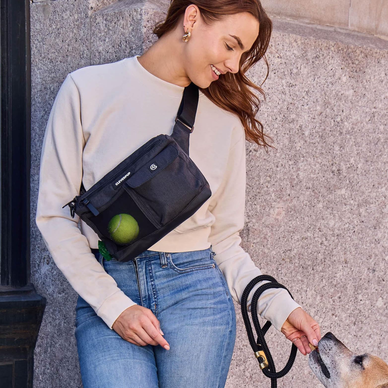 Cleverpup sling bag poop bag dispenser helps tidy trips with your pup.