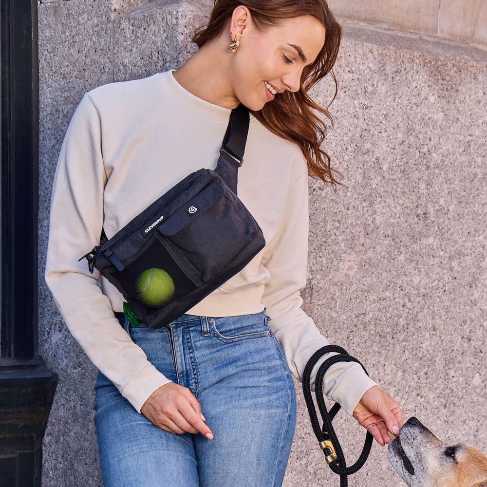 Cleverpup sling bag poop bag dispenser helps tidy trips with your pup.