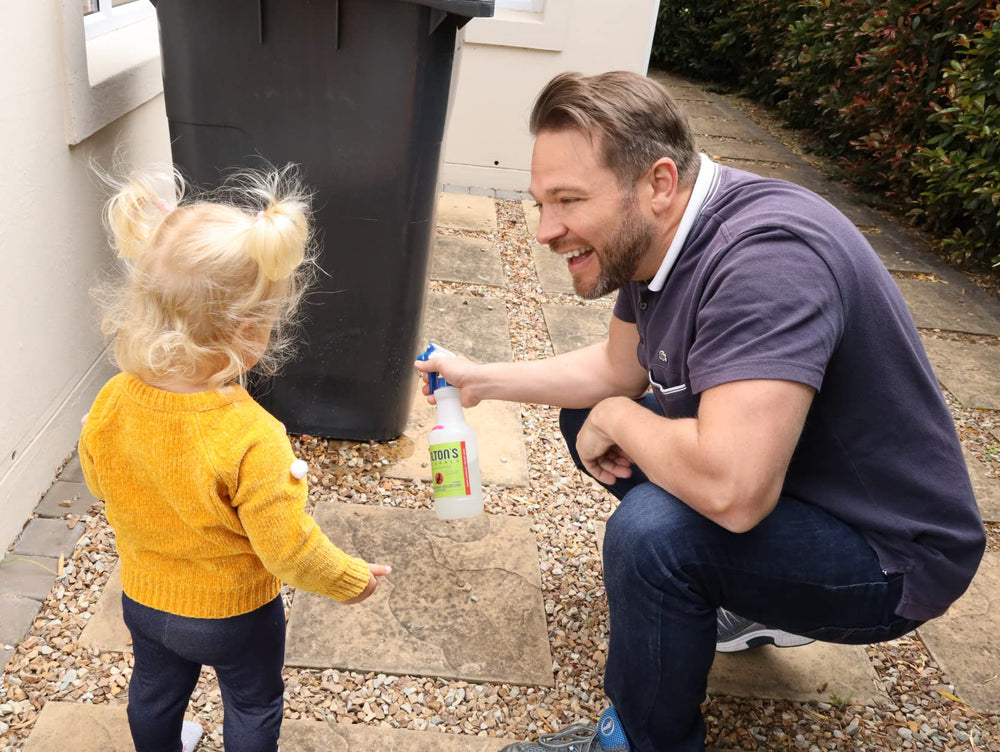 Colton's Naturals cat-repellent-outdoor-spray applied around a trash area.