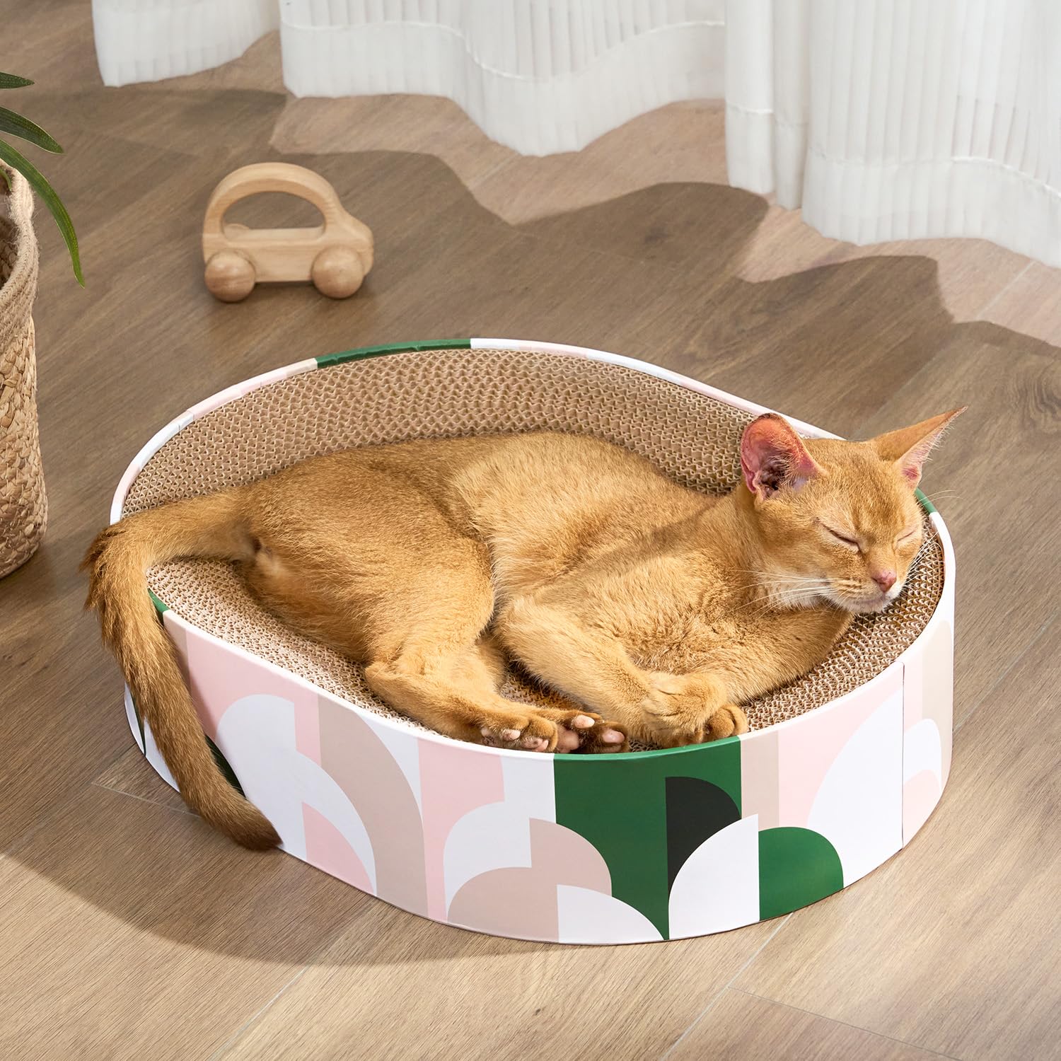Conlun cat scratcher cardboard oval design provides ergonomic support for lounging and scratching.