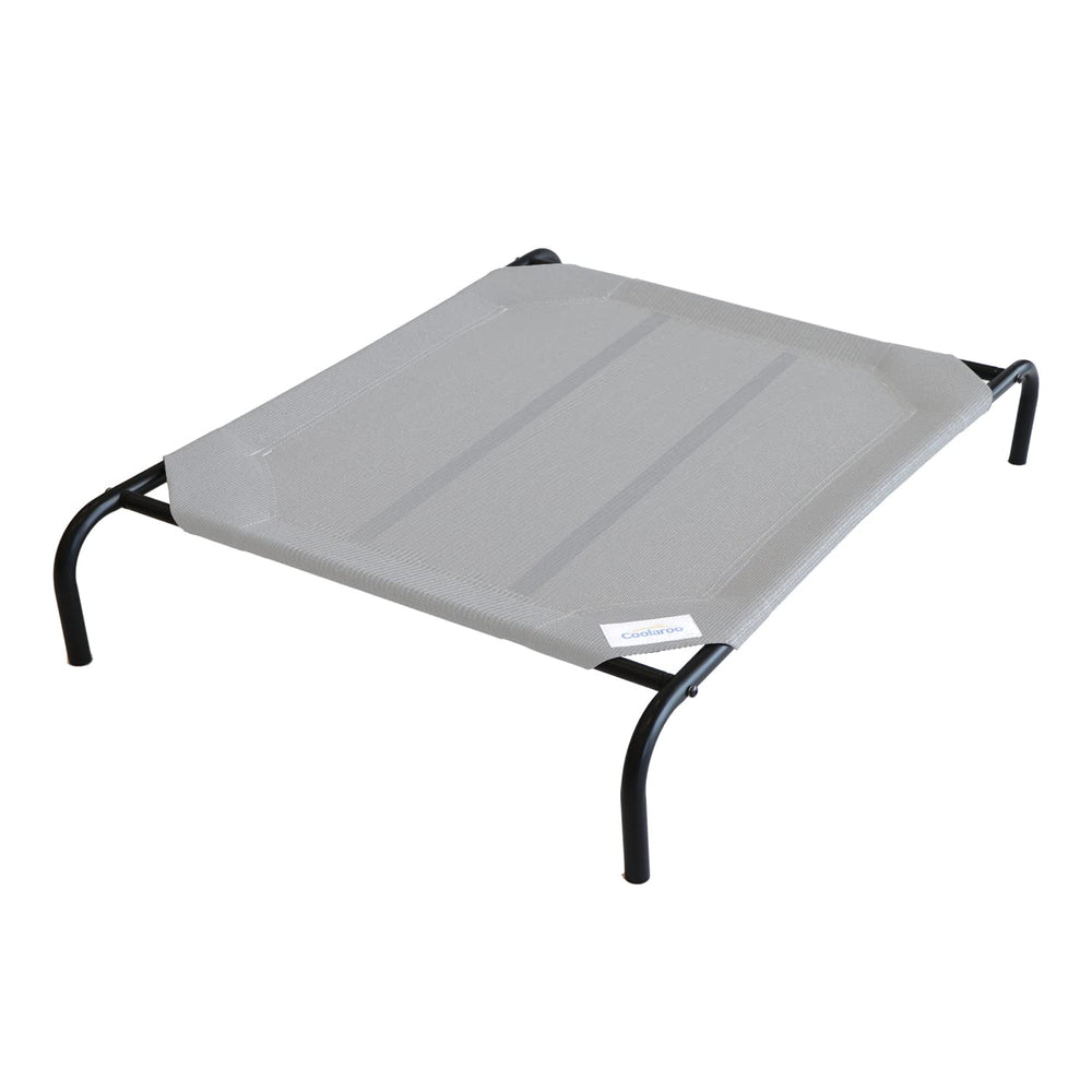 Coolaroo Original Elevated Dog Bed on patio showing cooling airflow for comfortable outdoor lounging.