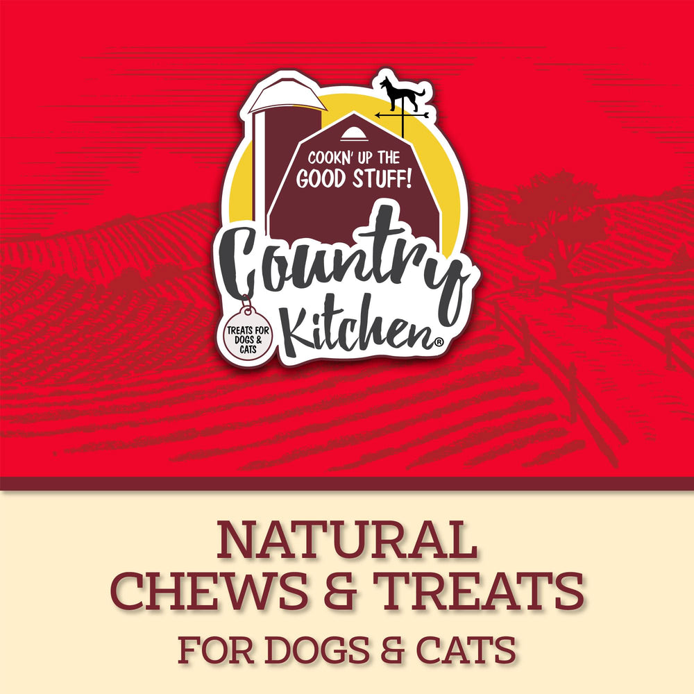 Dog enjoying a Country Kitchen Duck Jerky Tender during playtime