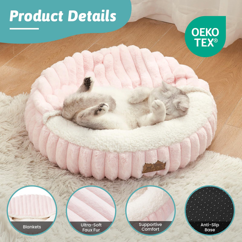 COZY KISS pink donut cuddle bed adds warmth and comfort for cats.