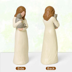 Cuayaes cat mom holding grey cat figurine, comforting remembrance