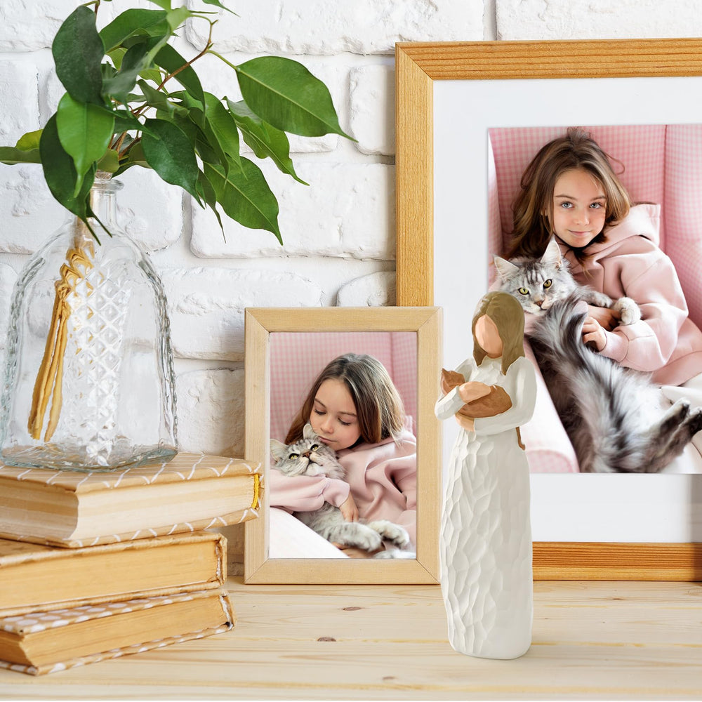 Cuayaes guardian angel cat figure, symbolizes enduring friendship and comfort.