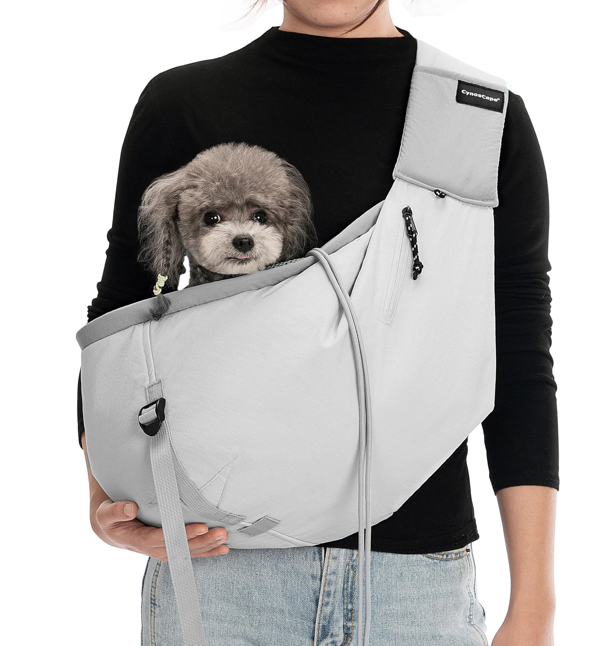 CynosCape small-dog sling carrier front view with secure, comfortable hold.