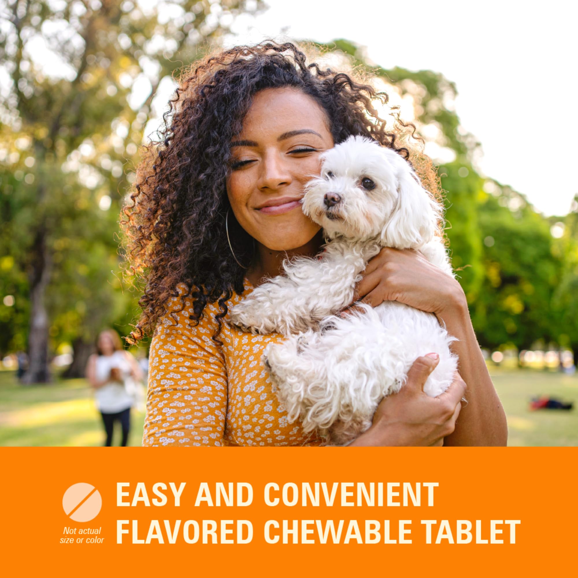 Dog chewing a Worm X Plus tablet for simple administration.