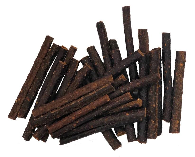 Broken pieces of Dog Delights Chewy Duck Sticks ideal for training rewards.