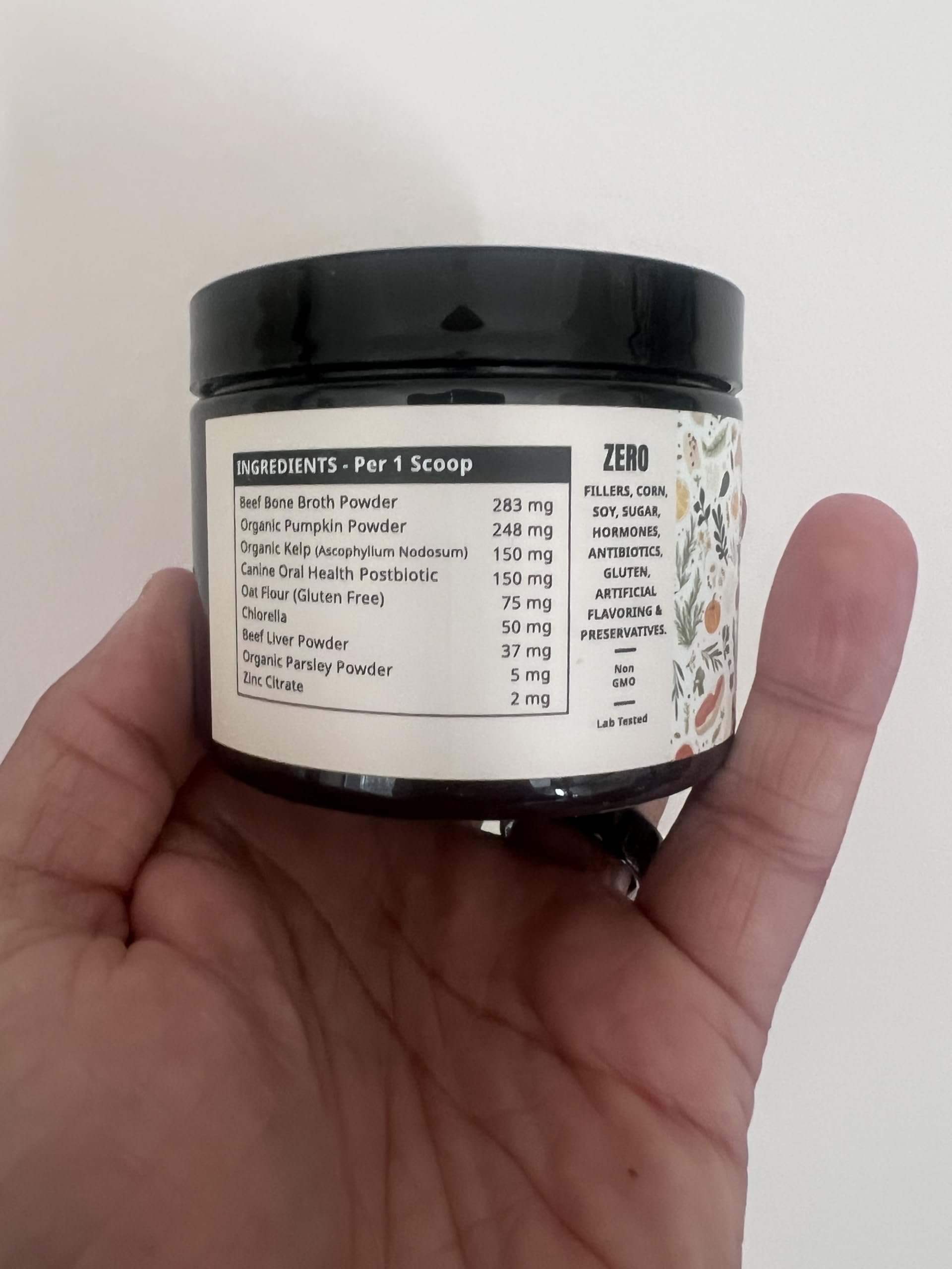 Dogbiotics DE-01 dental powder on food bowl for fresh breath potential.