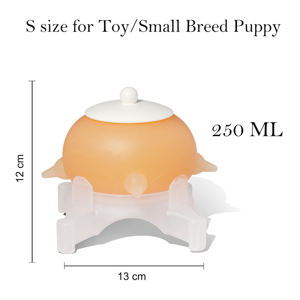 Doggiema puppy-milk-feeder in-use showcases hands-on feeding technique.