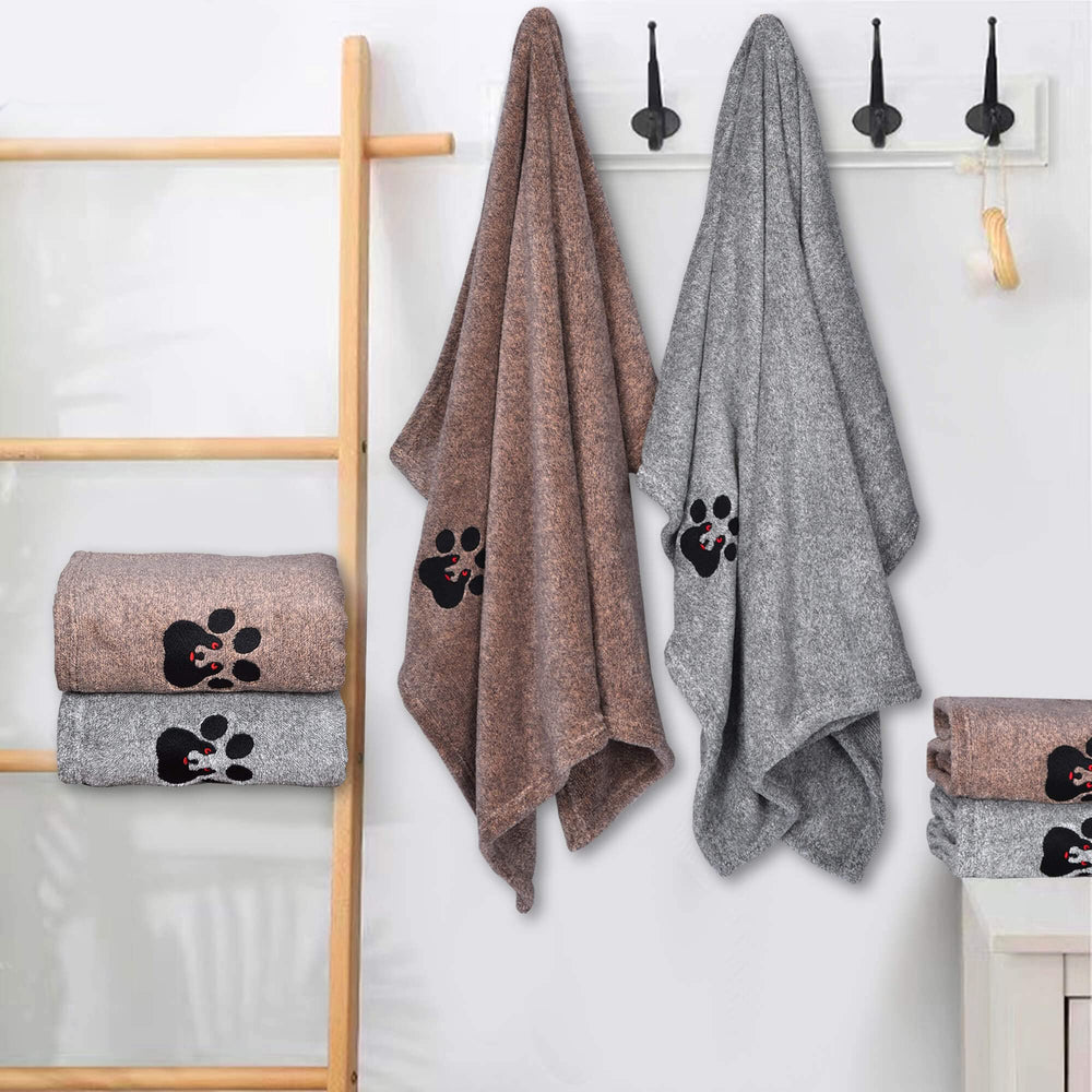 Dogvingpk towel in use to dry a wet dog after a bath.
