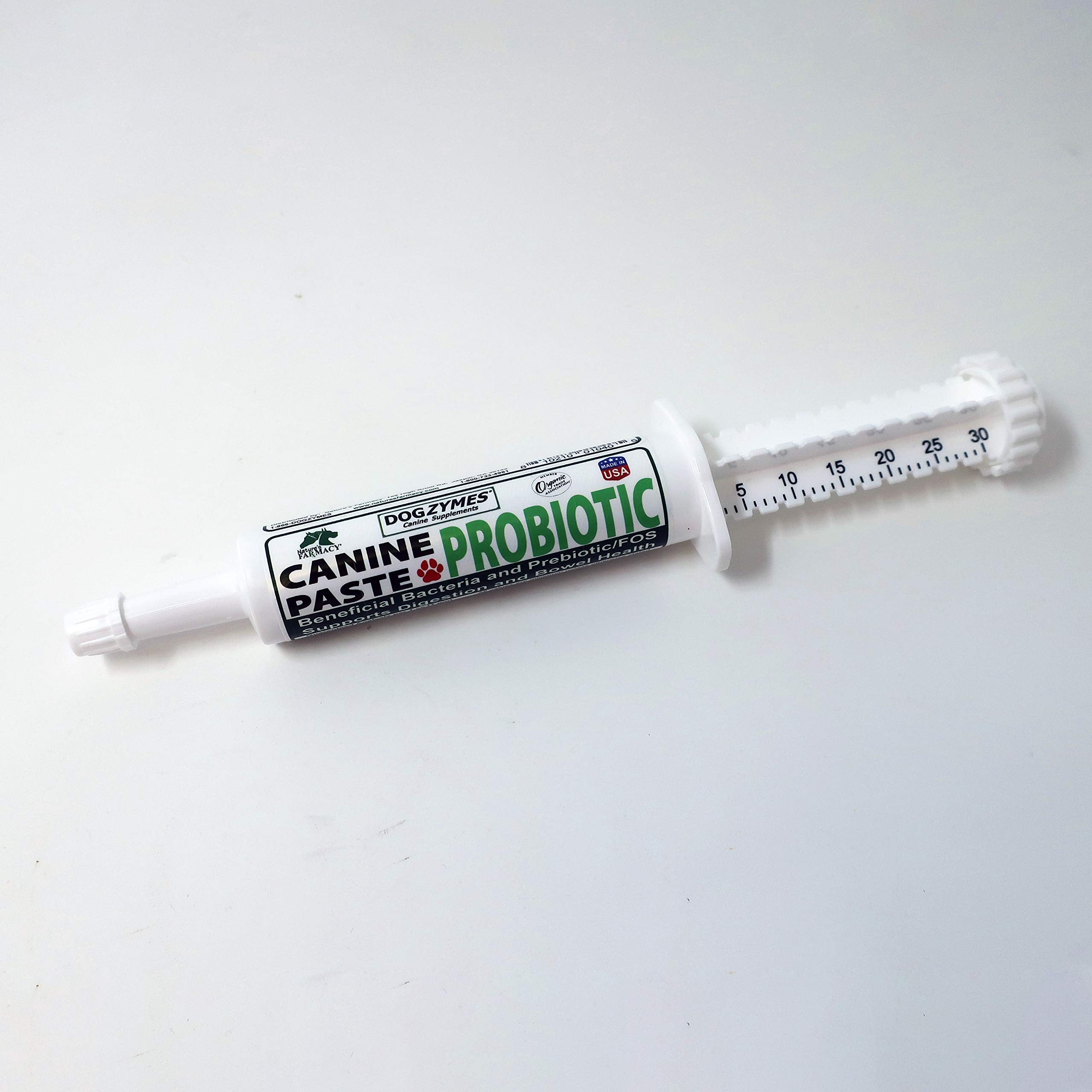 Dogzymes paste on dog food for easy administration.