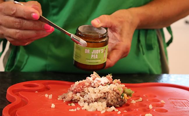 Dosing spoon shows easy, precise daily administration for small dogs.