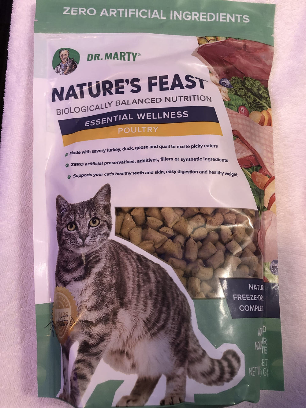 Dr. Marty Nature's Feast poultry cat food promotes digestion and a shiny coat.