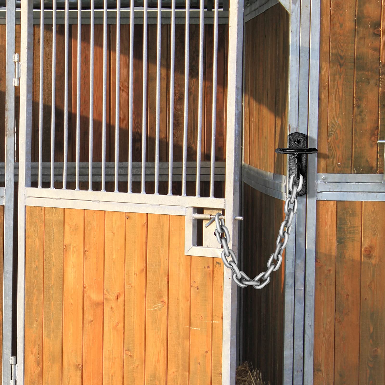Dunzy bucket hooks securing door chains and latches in a barn.