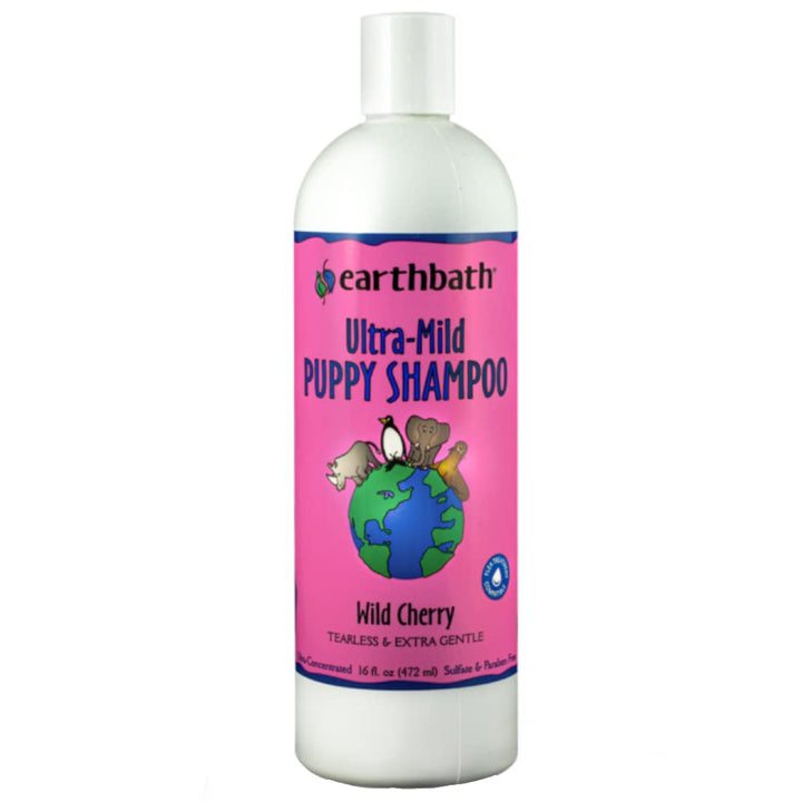 Earthbath Wild Cherry Puppy Shampoo bottle pour showing a gentle, odor-neutralizing wash for puppies