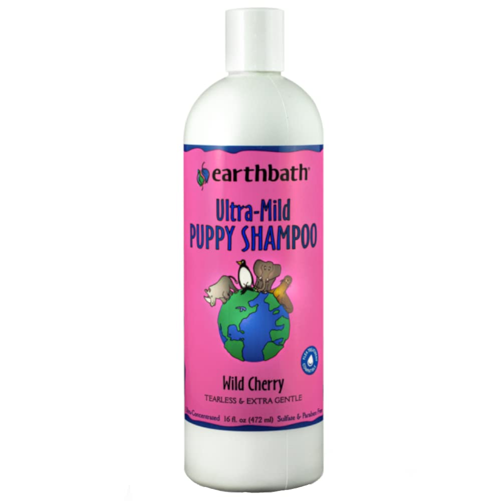 Earthbath Wild Cherry Puppy Shampoo bottle pour showing a gentle, odor-neutralizing wash for puppies