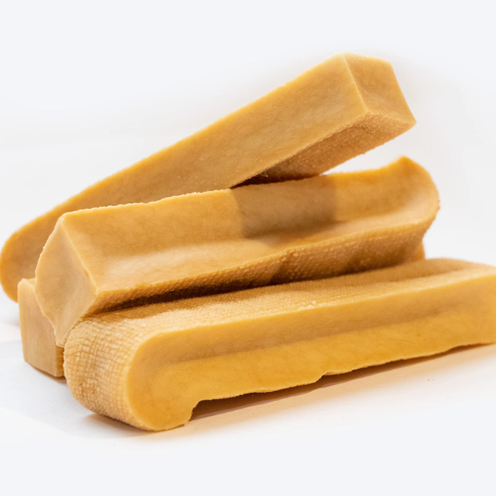 EcoKind Yak Cheese Himalayan dog chews in bowl highlighting natural ingredients