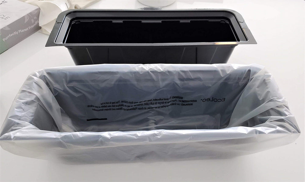 Edges folded over the receptacle for secure disposal.