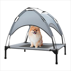 Eofritt outdoor elevated dog bed with canopy provides shaded comfort for camping dogs.