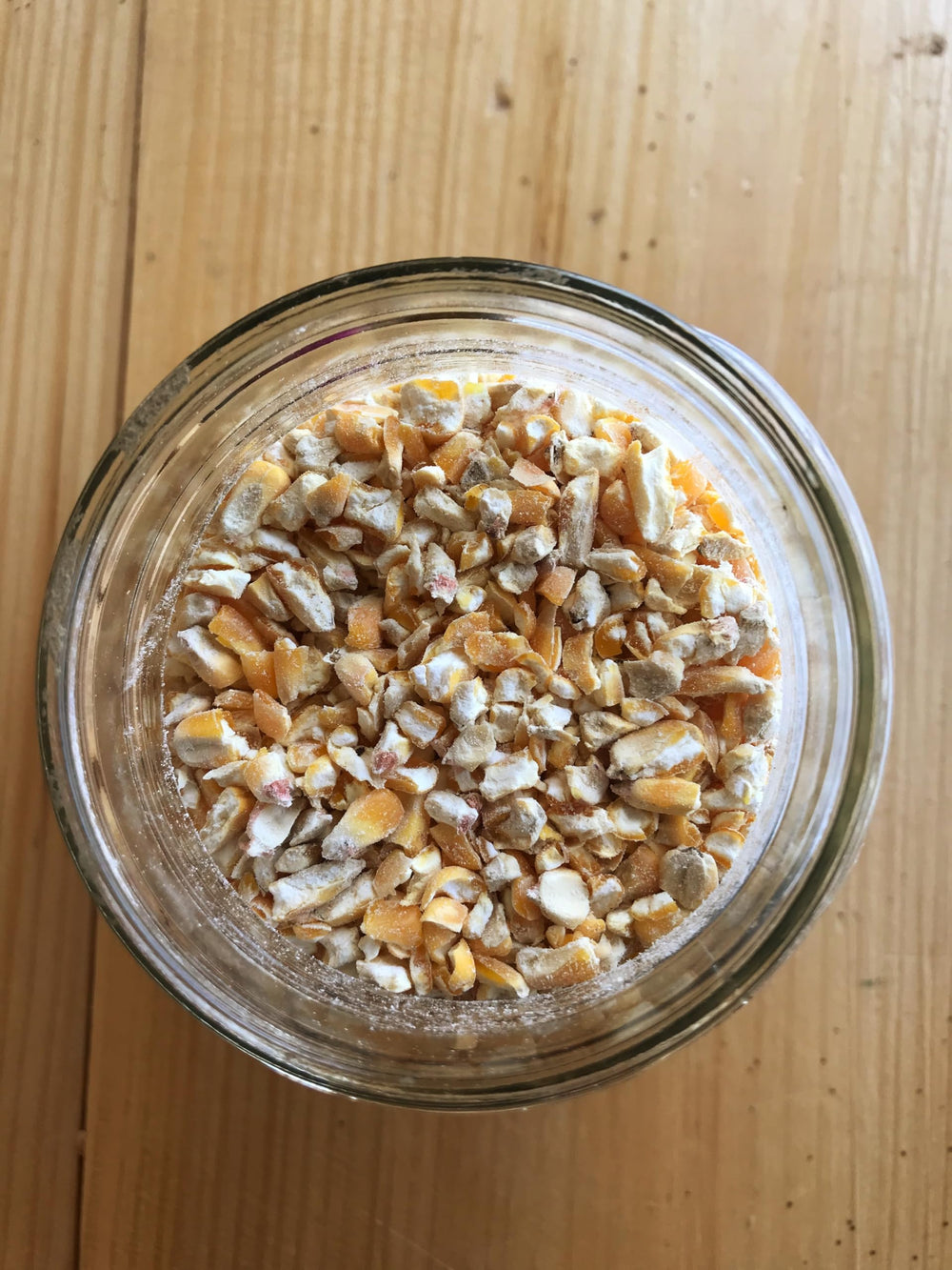 Ernst Grain cracked corn open bag close-up showing clean, uniform kernels