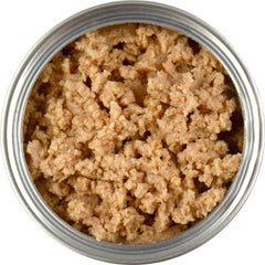Close-up of Evanger's Organic Turkey Dinner ingredients featuring turkey, potatoes, and carrots
