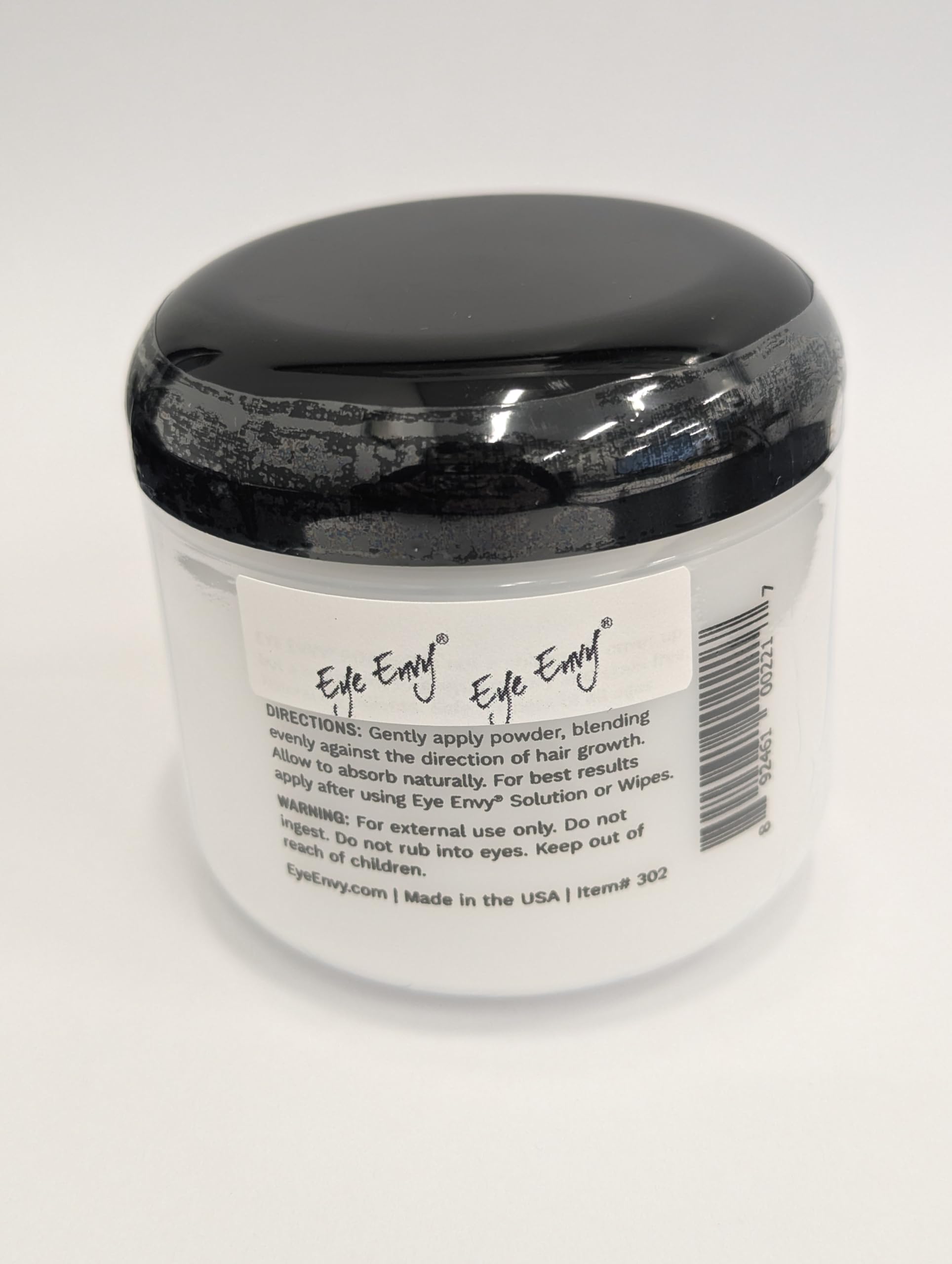 Eye Envy Tear Stain Powder applied with fingertip for precise application