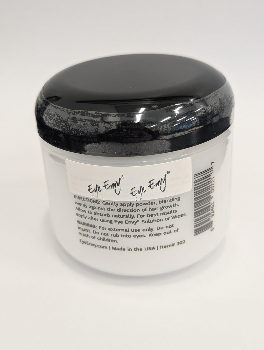 Eye Envy Tear Stain Powder applied with fingertip for precise application