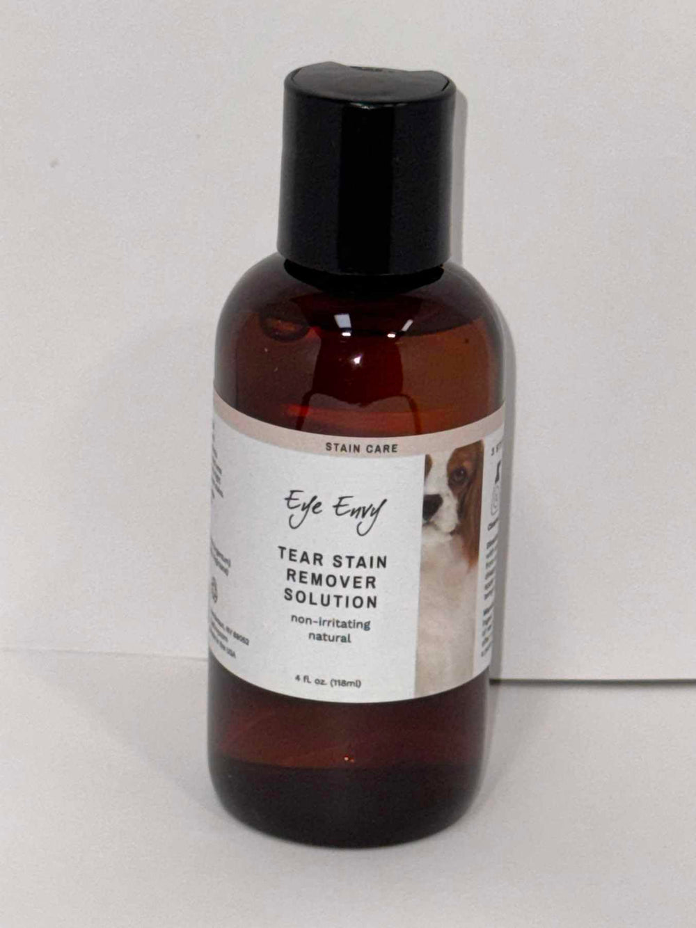 Eye Envy Tear Stain Remover used during dog grooming sessions.
