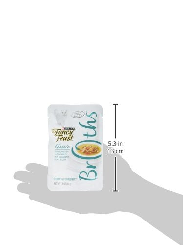 Fancy Feast Broths Classic real chicken and vegetables visible in the pouch.