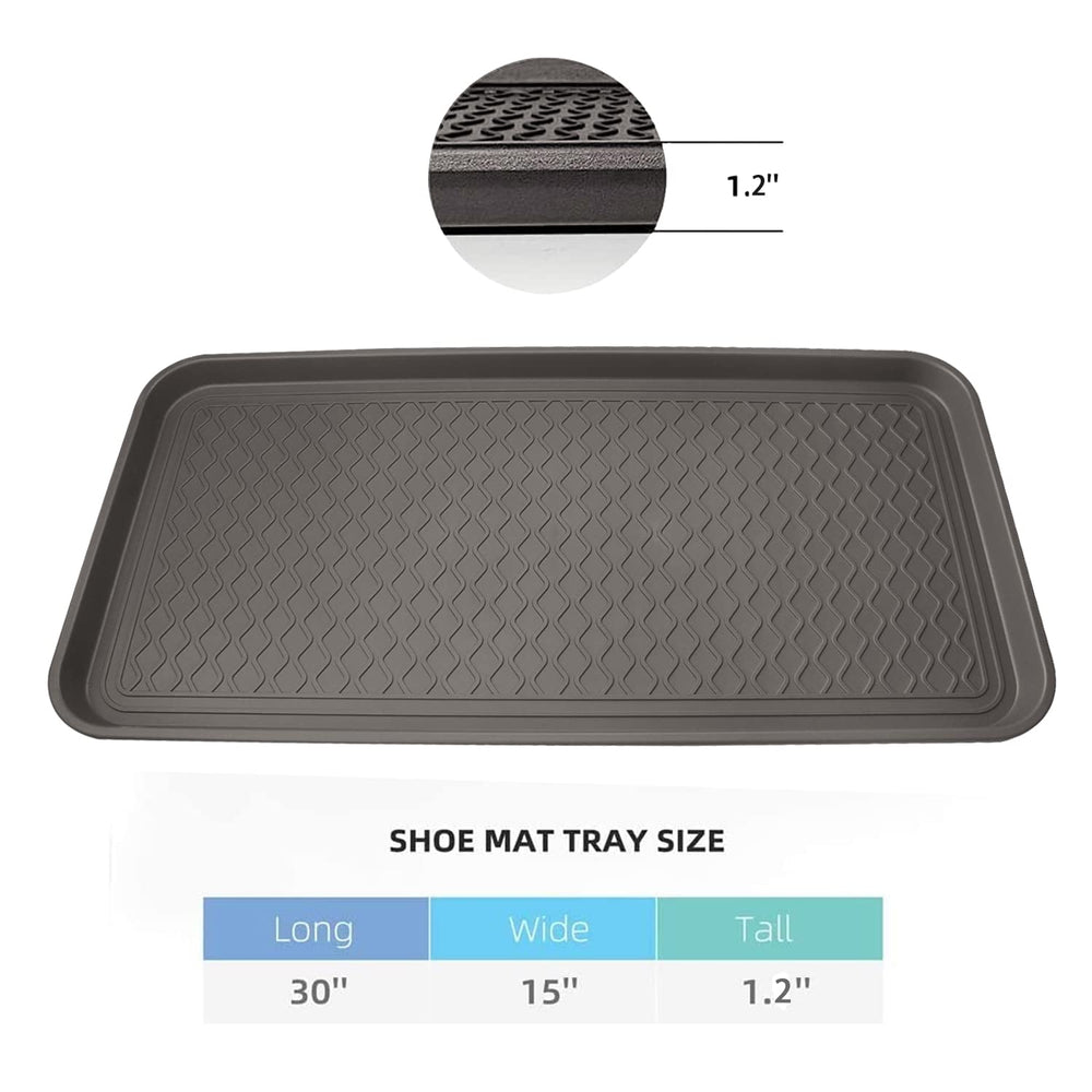 Finorder boot trays with raised rim containing melted snow.