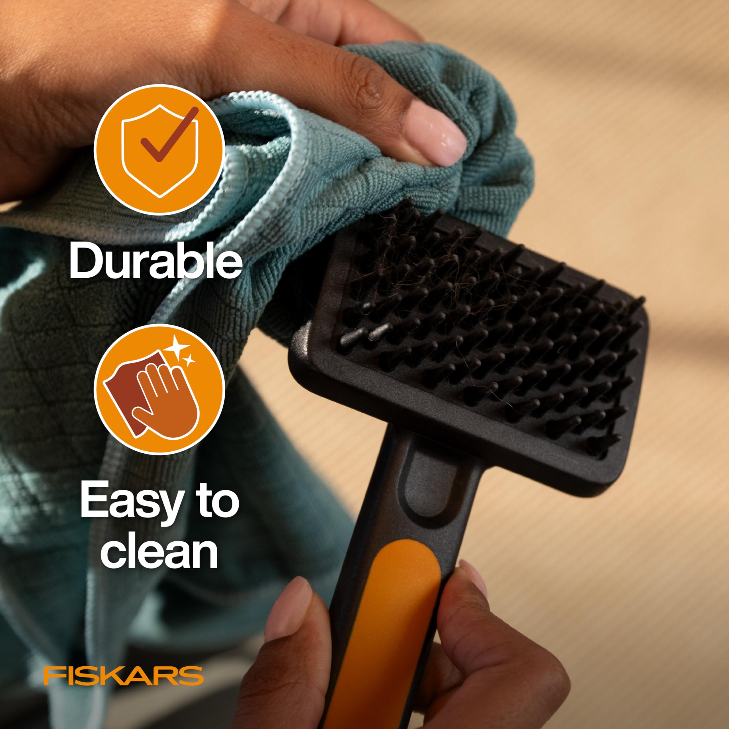Fiskars Pet Massage Brush six-point-five-inch length for easy handling.