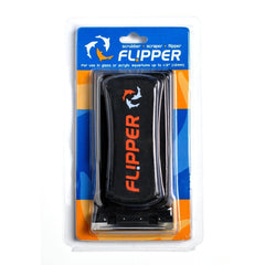 Flipper Standard algae magnet cleaner on glass surface for hands-free scrubbing.