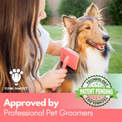 Flying Pawfect ergonomic handle brush showing comfortable grip for grooming.