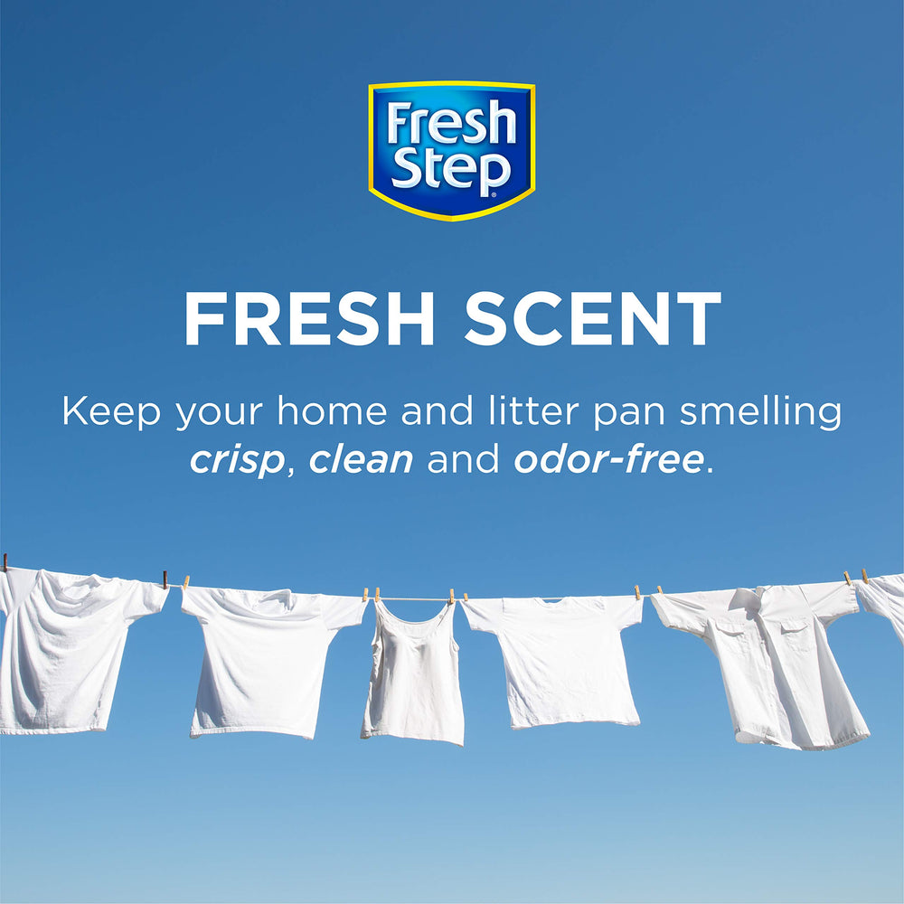 Fresh Step crystals sprinkled into a litter box for ongoing freshness.
