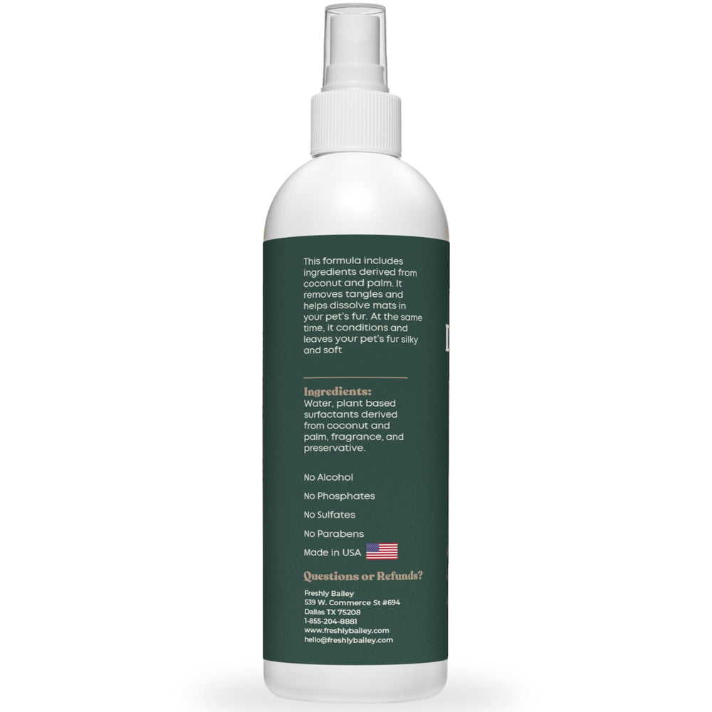 Spray is applied to doodle coat to simplify detangling.
