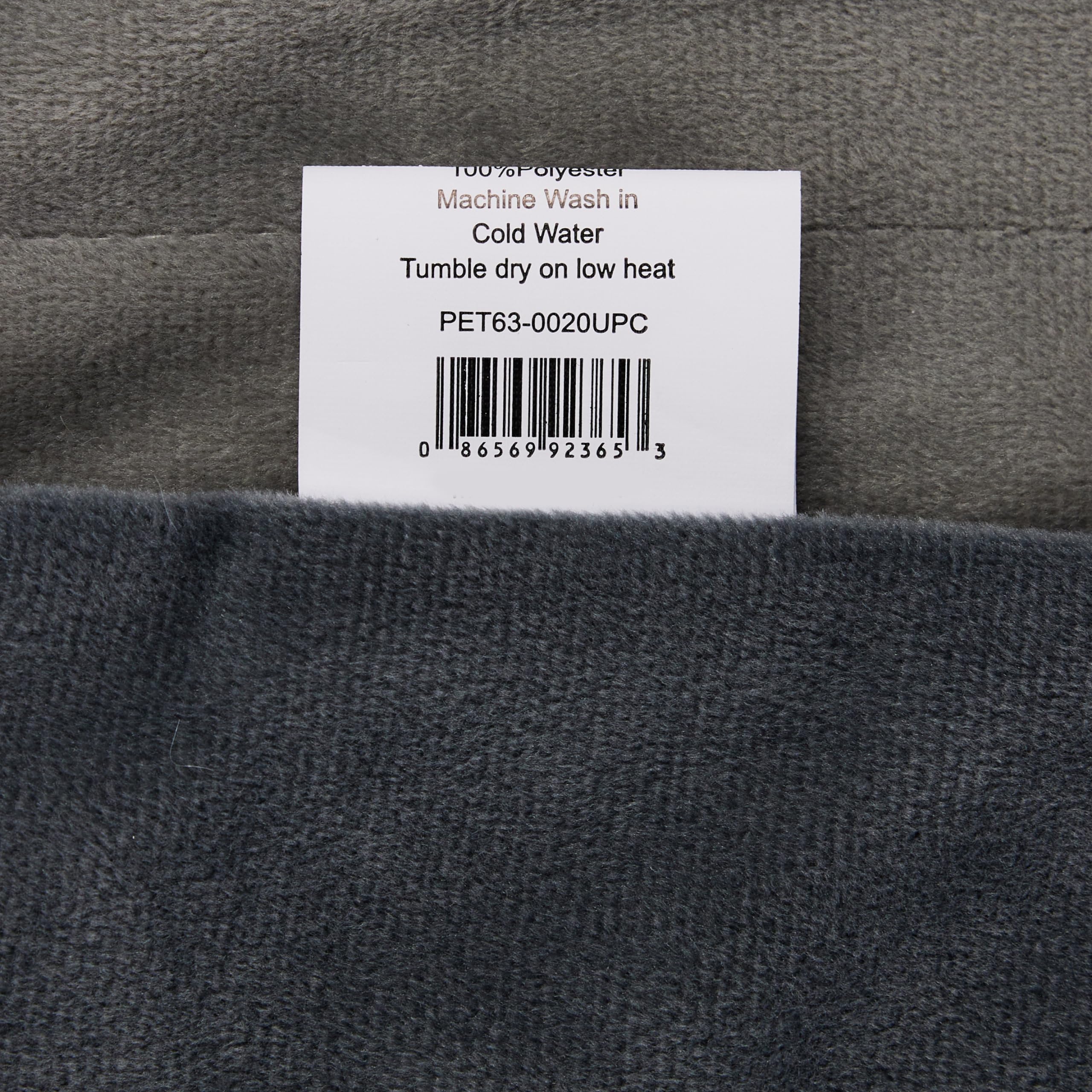 Friends Forever Bailey blanket draped over bed for warm pet comfort and protection.