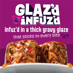 Friskies crab chunks in gravy close-up showing meaty texture for cats.