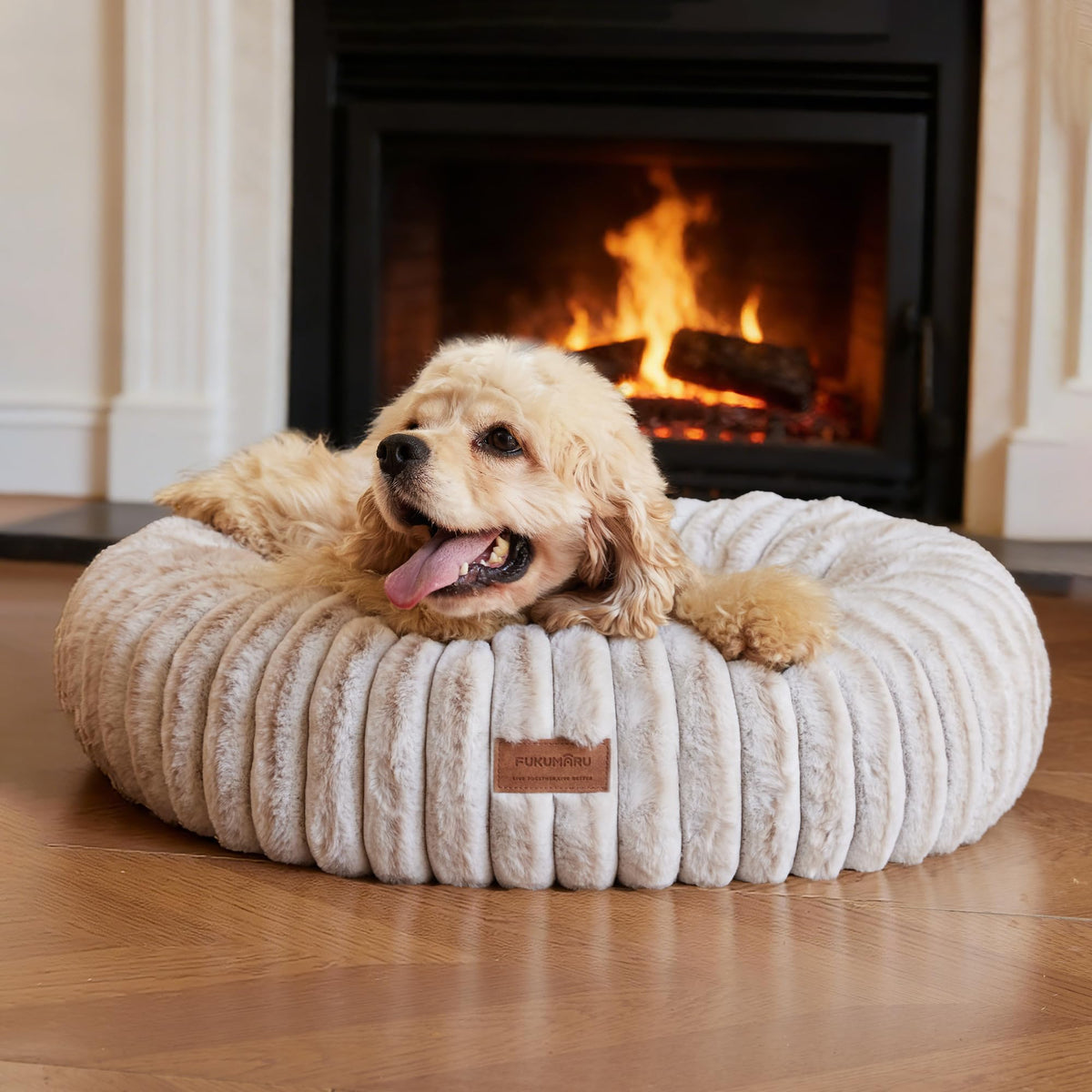 FUKUMARU gradient donut bed cover highlights calming, cocoon-like support.